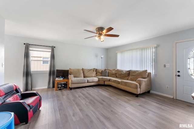 2506 Holly Dr, Bettendorf, IA 52722 - living area with a ceiling fan and light wood-style flooring