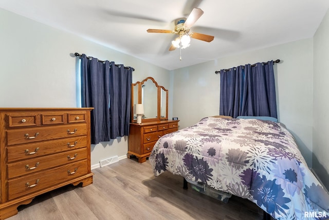 2506 Holly Dr, Bettendorf, IA 52722 - bedroom featuring light wood-style flooring and ceiling fan