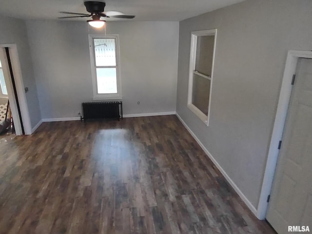 1319 Warren St, Davenport, IA 52804 - unfurnished room with radiator, ceiling fan, and dark wood-style flooring