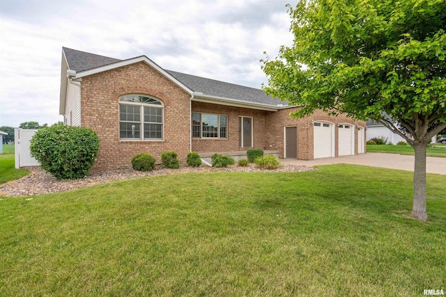922 W Scott St, Eldridge, IA 52748 - ranch-style house featuring brick siding, driveway, a garage, a front lawn, and roof with shingles