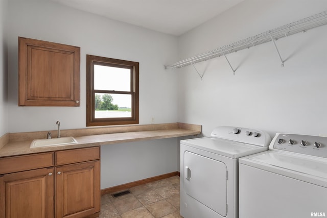 922 W Scott St, Eldridge, IA 52748 - washroom featuring independent washer and dryer and cabinet space