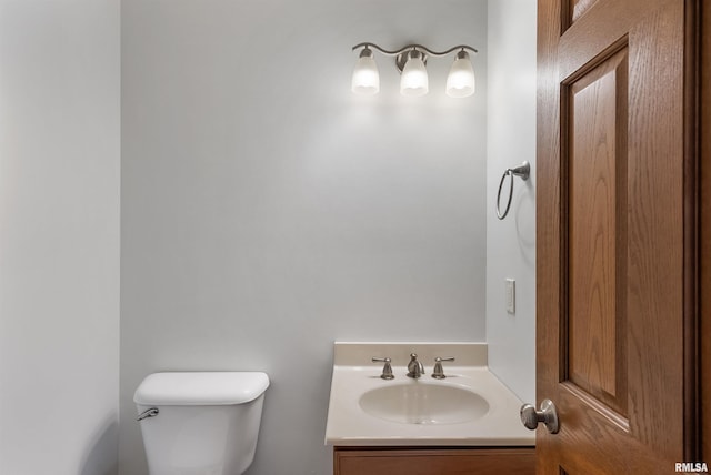922 W Scott St, Eldridge, IA 52748 - bathroom with toilet and vanity