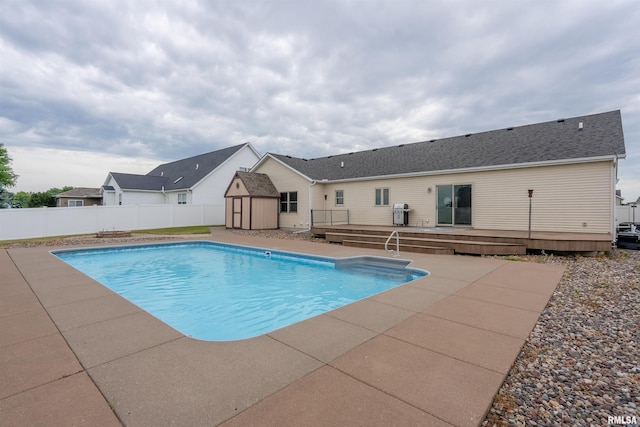 922 W Scott St, Eldridge, IA 52748 - view of swimming pool featuring a shed, a deck, and a patio area