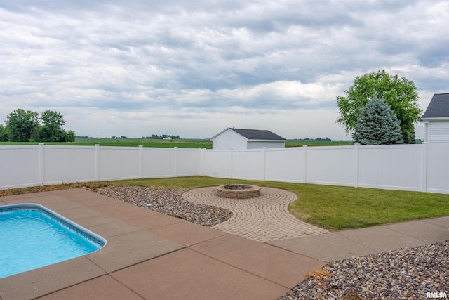 922 W Scott St, Eldridge, IA 52748 - view of swimming pool with a fenced backyard, a fire pit, and a patio