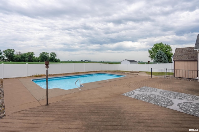 922 W Scott St, Eldridge, IA 52748 - view of pool with a deck and a fenced backyard
