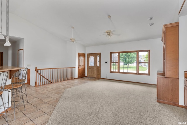 922 W Scott St, Eldridge, IA 52748 - entrance foyer featuring a ceiling fan, high vaulted ceiling, and light tile patterned floors