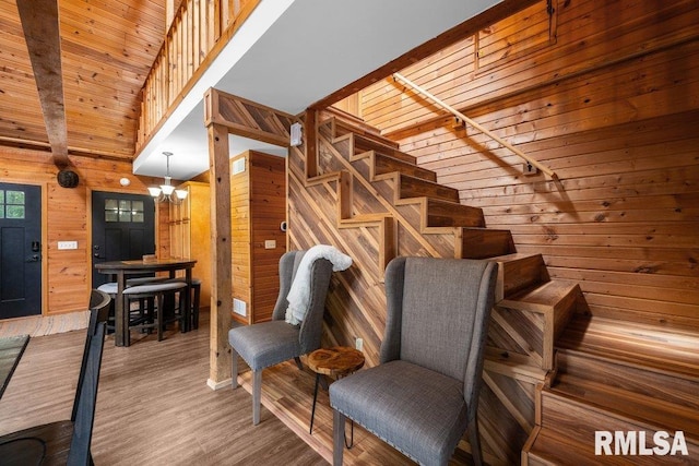 7319 106th Ave, Coal Valley, IL 61240 - stairs with wooden walls, wood finished floors, and wood ceiling