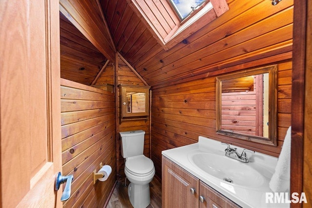 7319 106th Ave, Coal Valley, IL 61240 - bathroom featuring wooden ceiling, vanity, a skylight, and wood walls