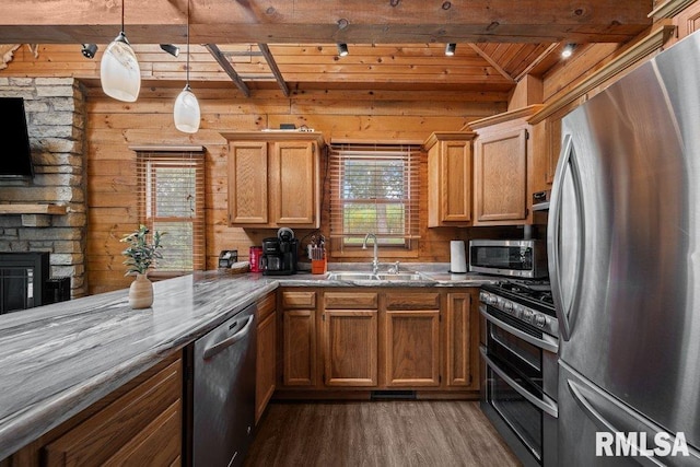 7319 106th Ave, Coal Valley, IL 61240 - kitchen featuring appliances with stainless steel finishes, wood finished floors, healthy amount of natural light, a wooden ceiling with exposed beams, and decorative light fixtures