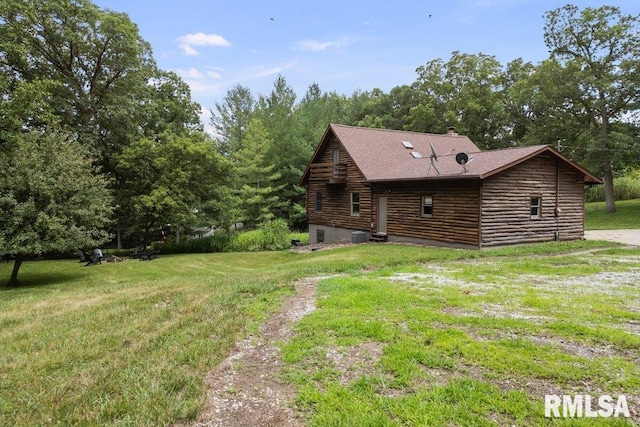 7319 106th Ave, Coal Valley, IL 61240 - view of side of home featuring a yard, a shingled roof, log exterior, and a chimney