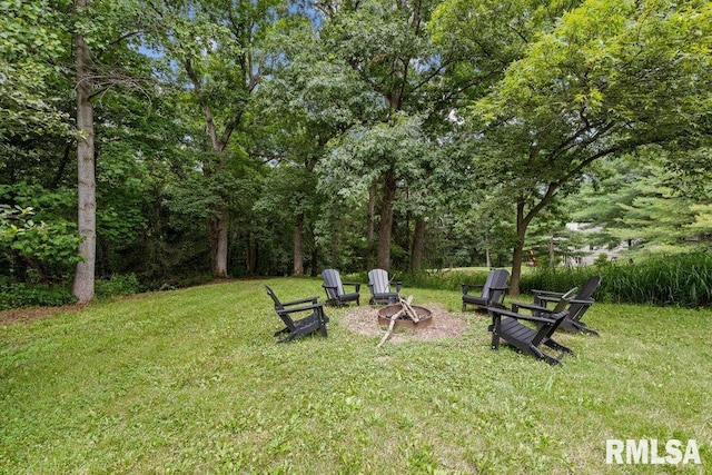 7319 106th Ave, Coal Valley, IL 61240 - view of green lawn featuring a fire pit