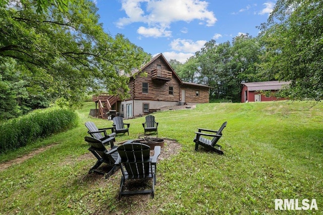 7319 106th Ave, Coal Valley, IL 61240 - view of grassy yard with an outdoor fire pit, stairs, and a wooden deck
