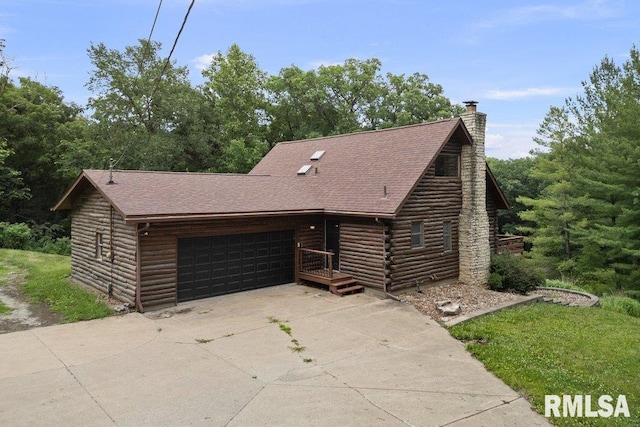 7319 106th Ave, Coal Valley, IL 61240 - log home featuring a garage, concrete driveway, a chimney, and roof with shingles