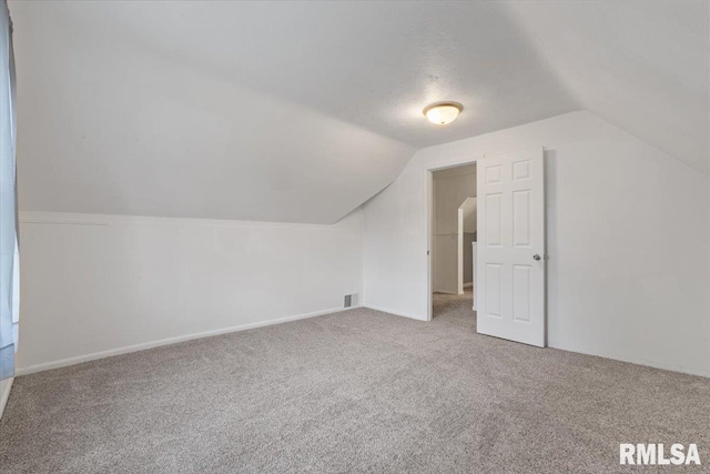 3916 W Locust St, Davenport, IA 52804 - additional living space with lofted ceiling and carpet