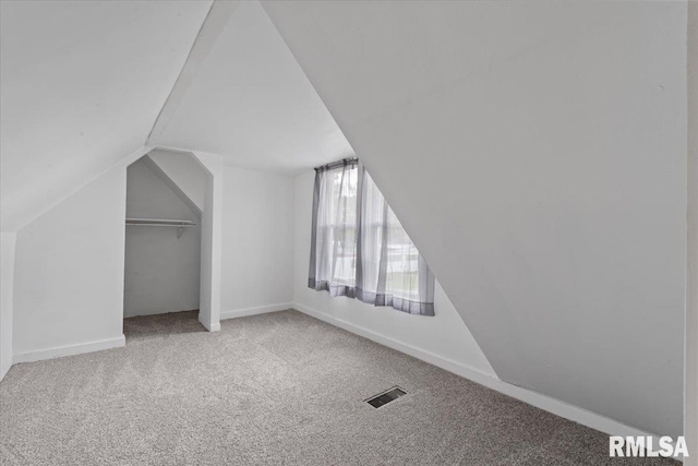 3916 W Locust St, Davenport, IA 52804 - additional living space with carpet and vaulted ceiling