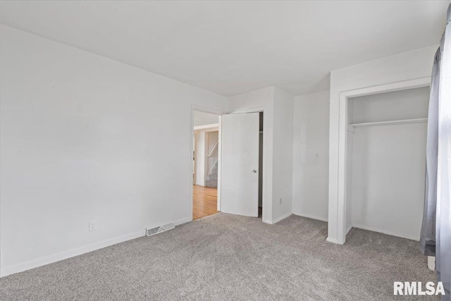 3916 W Locust St, Davenport, IA 52804 - unfurnished bedroom with carpet and baseboards