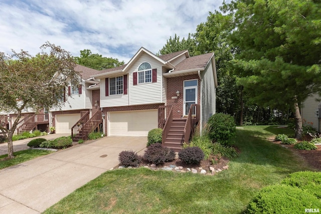 1263 33rd Avenue Cir, Silvis, IL 61282 - bi-level home with stairs, driveway, a garage, and brick siding