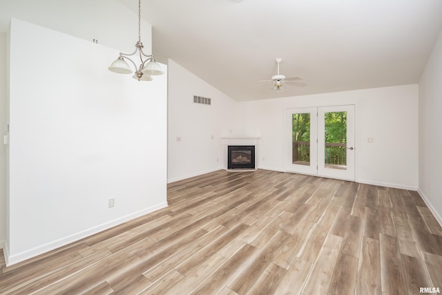 1263 33rd Avenue Cir, Silvis, IL 61282 - unfurnished living room featuring a ceiling fan, light wood-style flooring, a glass covered fireplace, and high vaulted ceiling