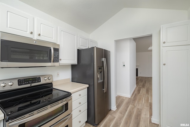 1263 33rd Avenue Cir, Silvis, IL 61282 - kitchen with stainless steel appliances, lofted ceiling, white cabinetry, light wood finished floors, and light countertops