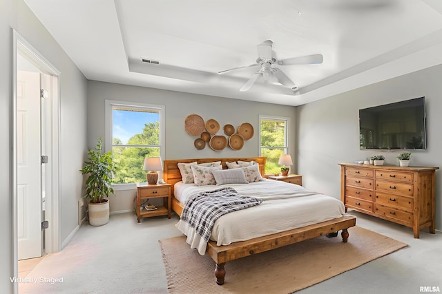 5320 Appleton Dr, Davenport, IA 52804 - bedroom featuring a raised ceiling, light colored carpet, and ceiling fan