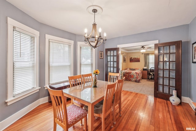 2510 Pershing Ave, Davenport, IA 52803 - dining space with a chandelier, light wood-type flooring, and french doors