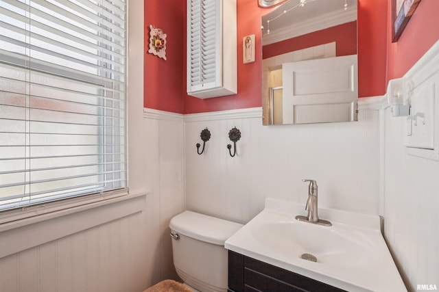 2510 Pershing Ave, Davenport, IA 52803 - bathroom with vanity, wainscoting, healthy amount of natural light, a decorative wall, and ornamental molding
