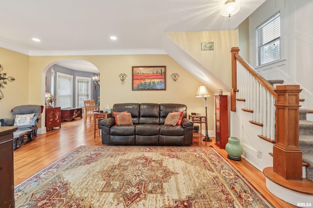 2510 Pershing Ave, Davenport, IA 52803 - living area featuring arched walkways, plenty of natural light, wood finished floors, crown molding, and recessed lighting