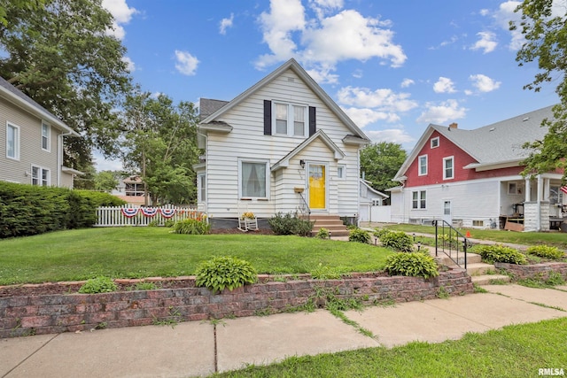 2510 Pershing Ave, Davenport, IA 52803 - bungalow-style home with a front yard and entry steps