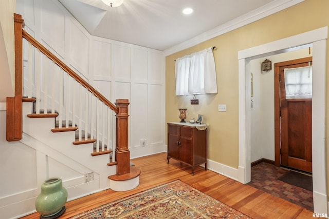 2510 Pershing Ave, Davenport, IA 52803 - foyer entrance with wood finished floors, stairs, and ornamental molding