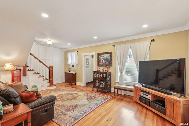 2510 Pershing Ave, Davenport, IA 52803 - living room featuring stairs, ornamental molding, hardwood / wood-style flooring, and recessed lighting