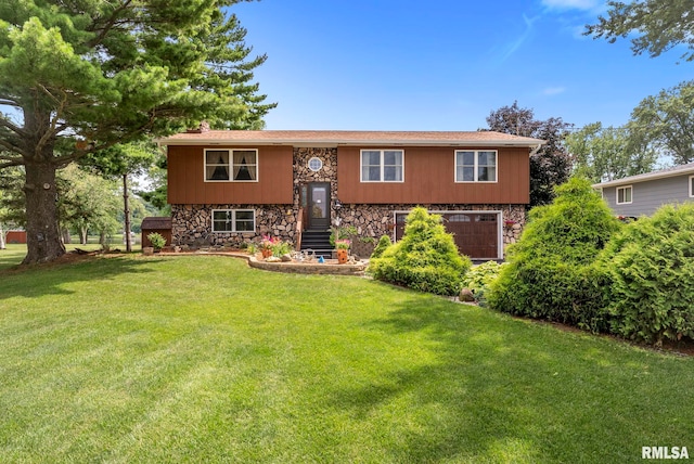 25622 1st Ave N, Hillsdale, IL 61257 - split foyer home featuring stone siding, a garage, and a front lawn