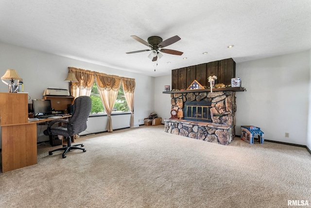 25622 1st Ave N, Hillsdale, IL 61257 - carpeted office space featuring a ceiling fan, a fireplace, and a textured ceiling