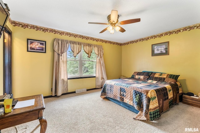 25622 1st Ave N, Hillsdale, IL 61257 - carpeted bedroom with a ceiling fan and baseboards