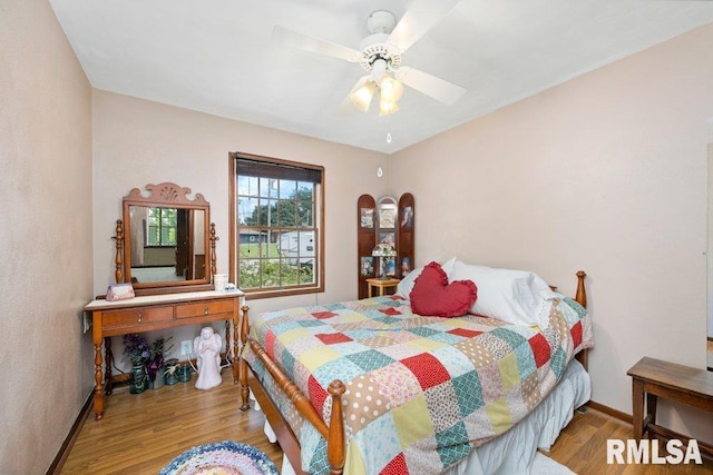 14325 139th Avenue Ct W, Taylor Ridge, IL 61284 - bedroom with wood finished floors and a ceiling fan