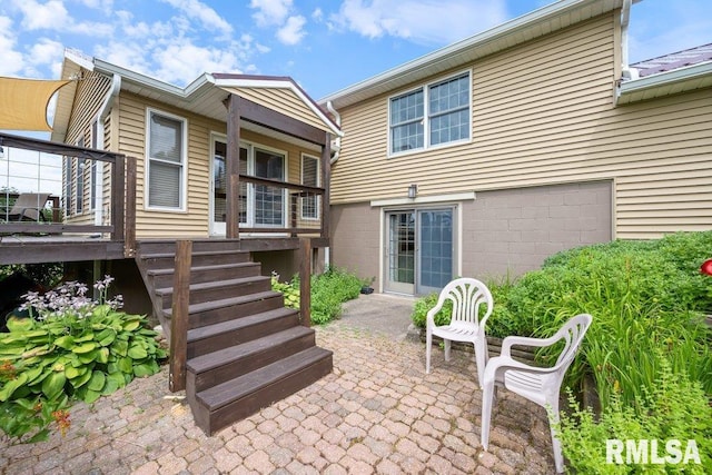 14325 139th Avenue Ct W, Taylor Ridge, IL 61284 - rear view of house with stairs and a patio