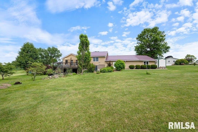 14325 139th Avenue Ct W, Taylor Ridge, IL 61284 - view of front of house with a front yard, a deck, and a metal roof