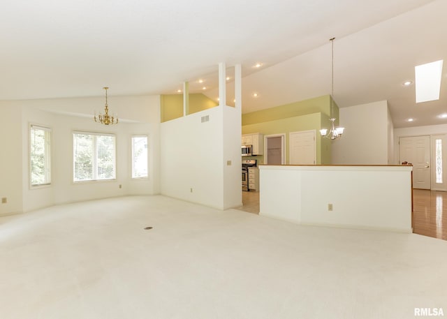 3439 Maple Glen Dr, Bettendorf, IA 52722 - unfurnished living room with a chandelier, light carpet, recessed lighting, and high vaulted ceiling