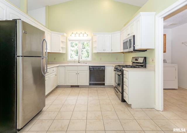3439 Maple Glen Dr, Bettendorf, IA 52722 - kitchen featuring stainless steel appliances, washer / dryer, open shelves, white cabinetry, and light countertops