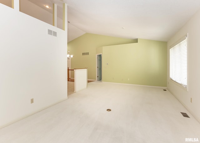 3439 Maple Glen Dr, Bettendorf, IA 52722 - unfurnished room featuring lofted ceiling and light carpet