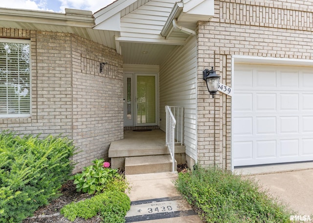 3439 Maple Glen Dr, Bettendorf, IA 52722 - entrance to property featuring a garage and brick siding