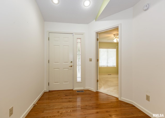 3439 Maple Glen Dr, Bettendorf, IA 52722 - entryway featuring wood finished floors, a ceiling fan, and recessed lighting