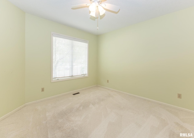 3439 Maple Glen Dr, Bettendorf, IA 52722 - empty room featuring light carpet and a ceiling fan