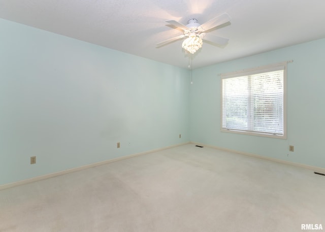 3439 Maple Glen Dr, Bettendorf, IA 52722 - spare room with light carpet and a ceiling fan