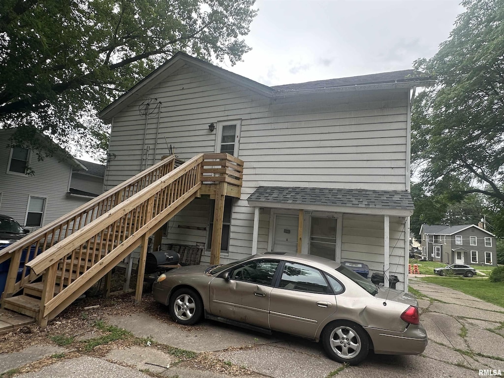 1328 E 9th St, Davenport, IA 52803 - view of front of property with a shingled roof and stairs