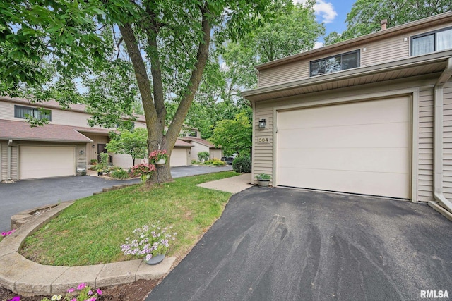 2809 12th Ave Unit 504, Rock Island, IL 61201 - view of front of house featuring a garage and driveway