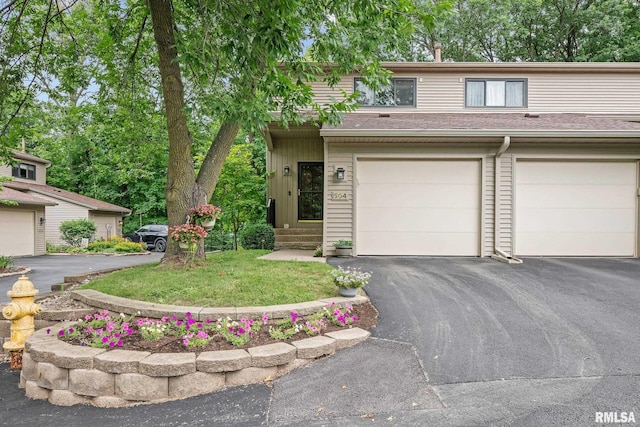 2809 12th Ave Unit 504, Rock Island, IL 61201 - view of front of home with asphalt driveway and a garage