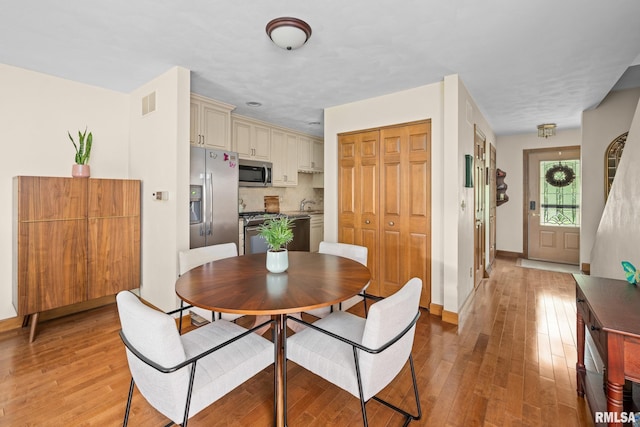 2809 12th Ave Unit 504, Rock Island, IL 61201 - dining room with light wood finished floors