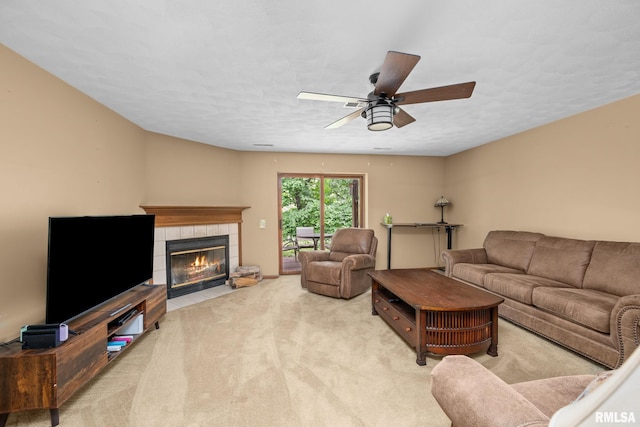 2809 12th Ave Unit 504, Rock Island, IL 61201 - carpeted living area with a tile fireplace and ceiling fan