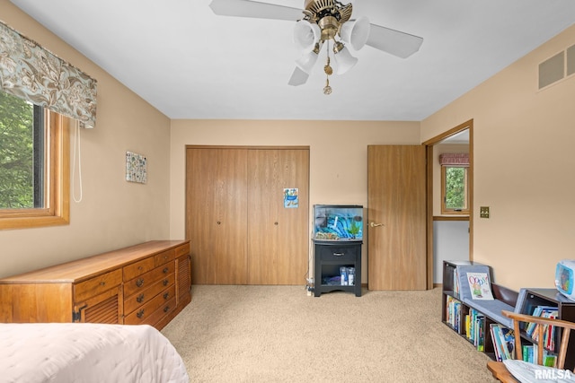 2809 12th Ave Unit 504, Rock Island, IL 61201 - carpeted bedroom featuring a closet and a ceiling fan