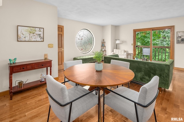 2809 12th Ave Unit 504, Rock Island, IL 61201 - dining room with light wood-type flooring and baseboards